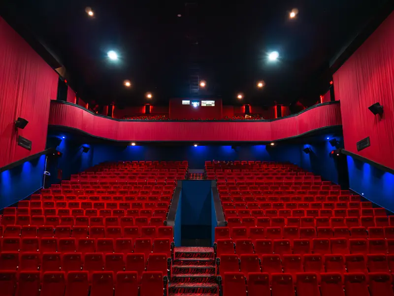 Red seats and screen view in the auditorium